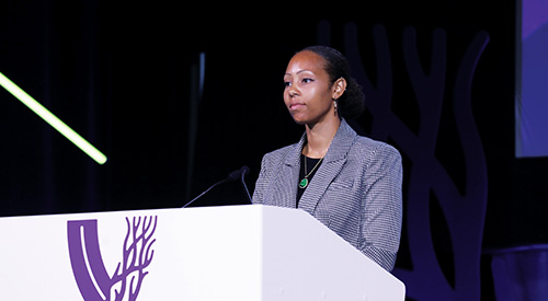 Woman presenting at podium